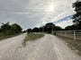 Ranch entrance from Red Bird lane.  Red bird is now chip-sealed.